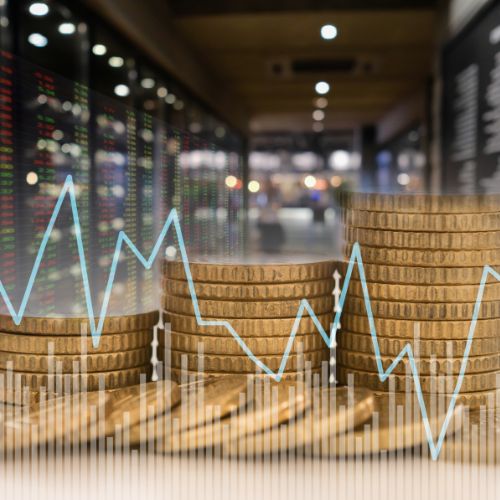 Stacks of coins with an overlay of a fluctuating financial graph, symbolizing investment analysis and market trends related to the Multi-Agent Investment Research Tool.